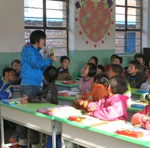 A teacher in China reading to her students after completing LEAPAsia's reading aloud workshop.